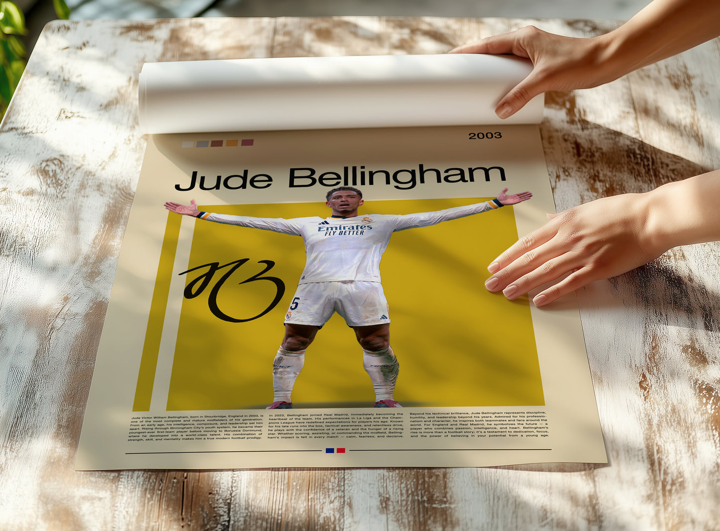 Jude Bellingham Real Madrid poster featuring the English football star with open arms in celebration. Modern sports wall art for fans and collectors, showcasing determination, strength, and passion for the game.
