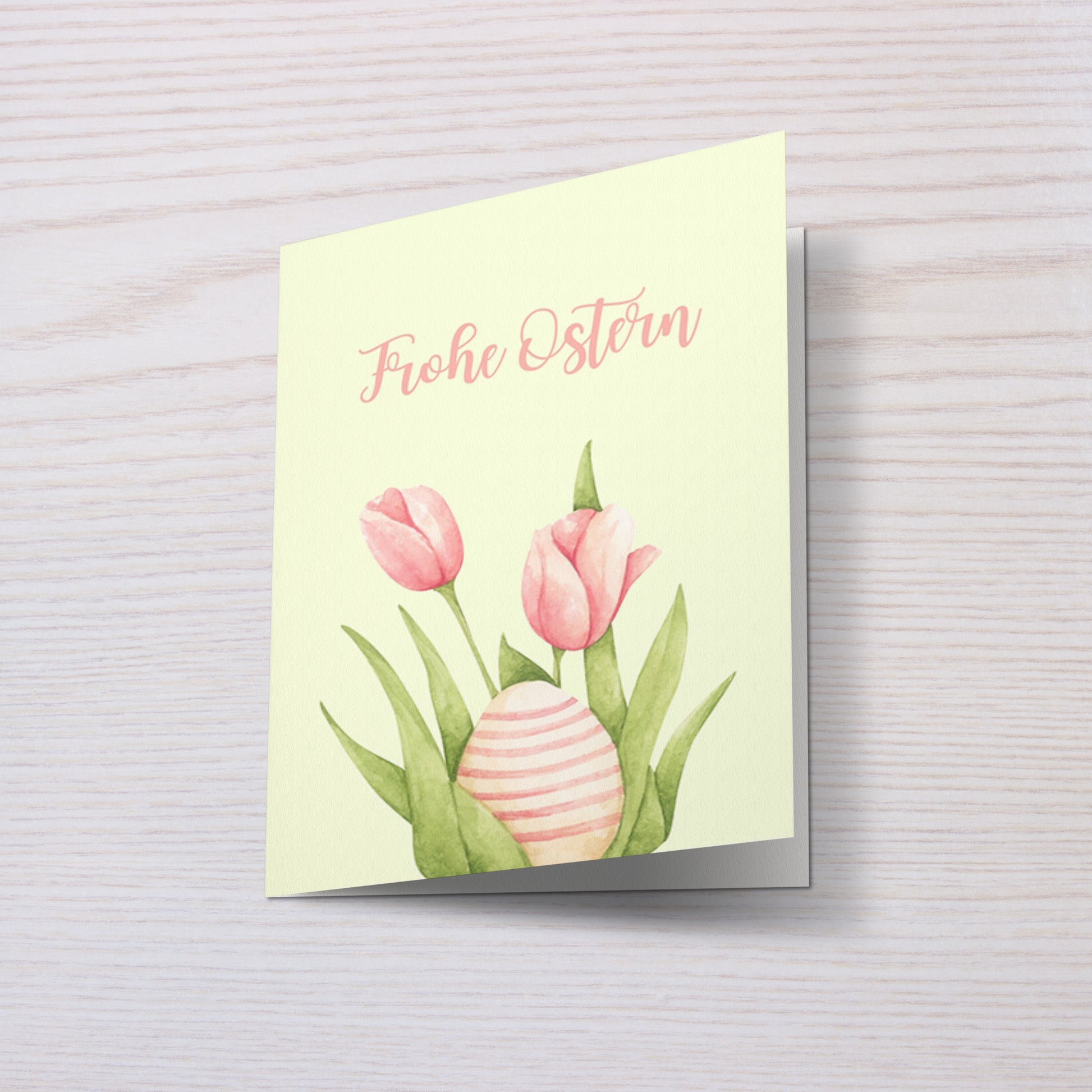 Elegante Osterkarte mit Tulpen und Osterei Illustration im Aquarell Stil. Sanfte Pastellfarben mit dem Schriftzug „Frohe Ostern“. Perfekt als Frühlings Grußkarte oder Osterkarte für Familie und Freunde.
