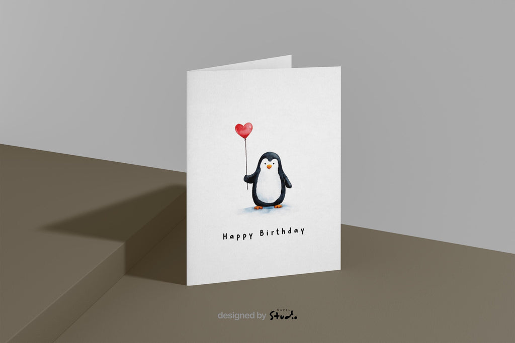 Niedliche Aquarell-Illustration eines kleinen Pinguins, der einen roten Herzballon hält. Darunter steht „Happy Birthday“. Die Karte strahlt Wärme, Freude und Zuneigung aus und eignet sich perfekt als Geburtstagskarte für Kinder, Partner, Freunde oder alle, die süße Tiermotive lieben.