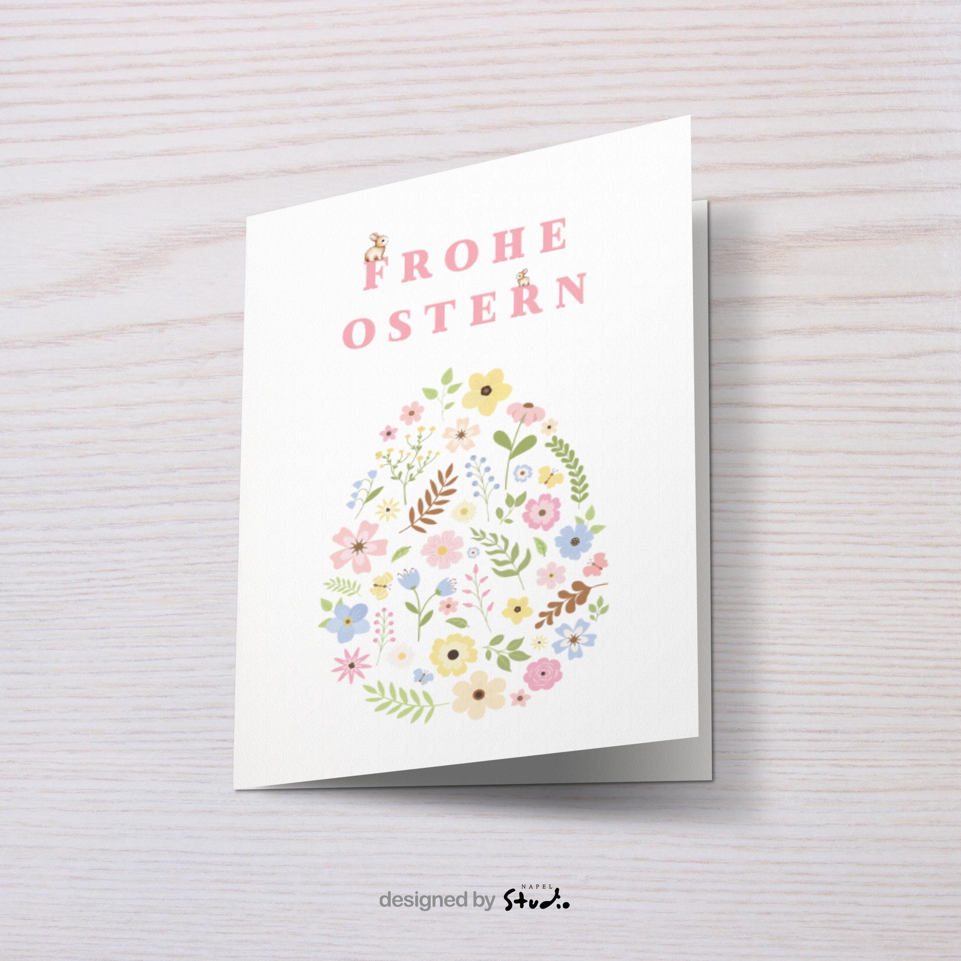 Zarte Oster Grußkarte mit floraler Illustration in Form eines Ostereis, feine Blumen und Blätter in sanften Pastellfarben, minimalistisches und elegantes Design, ideal als stilvolle Osterkarte für Familie, Freunde oder Kollegen, perfekte Frühlingskarte mit liebevollem Charakter.