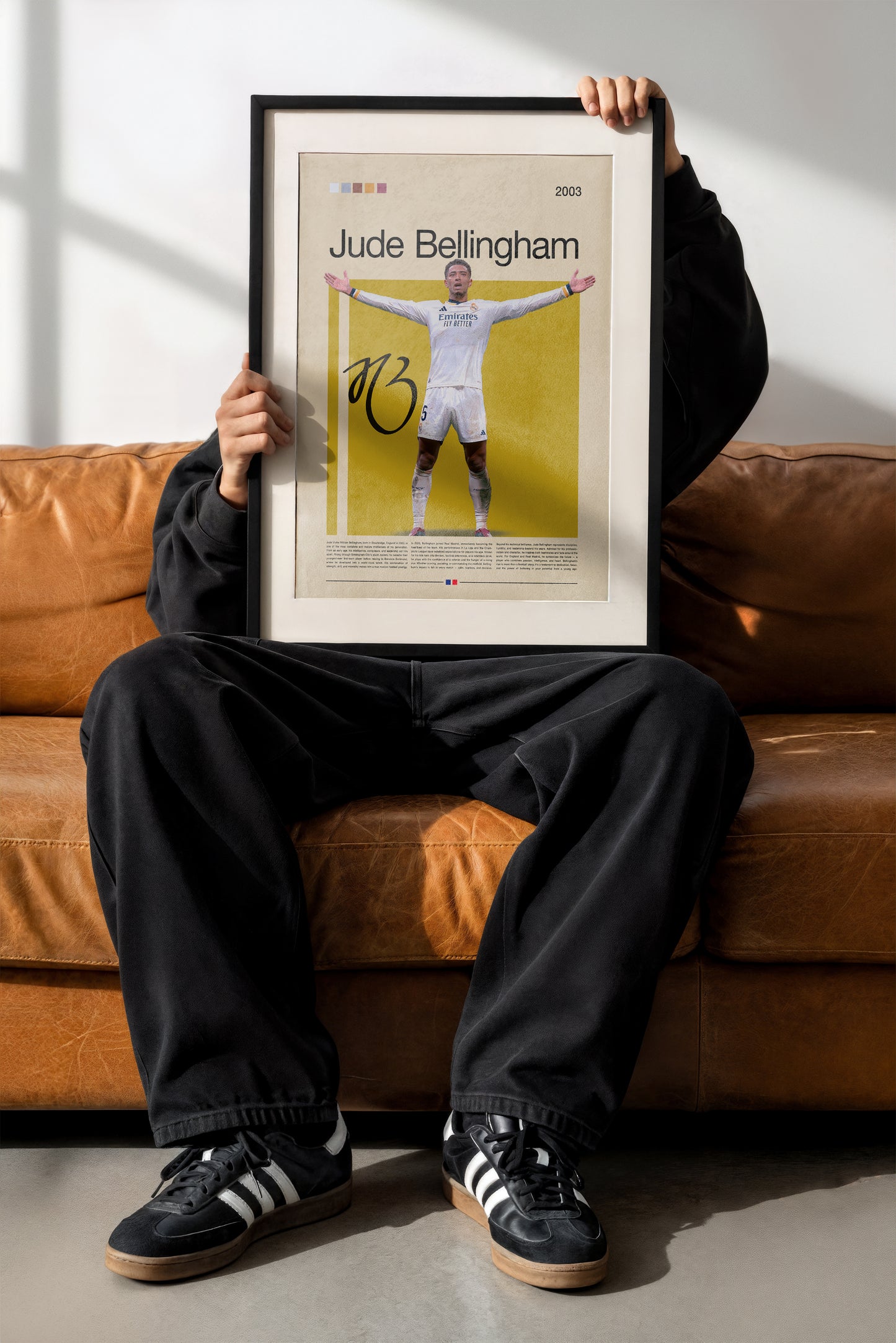 Jude Bellingham Real Madrid poster featuring the English football star with open arms in celebration. Modern sports wall art for fans and collectors, showcasing determination, strength, and passion for the game.