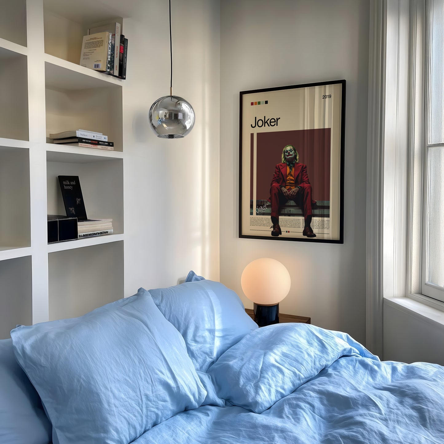 Minimalist Joker poster featuring Joaquin Phoenix in a red suit sitting under moody lighting on a dark red background. Inspired by the 2019 film Joker, this cinematic artwork captures emotion, isolation, and power – ideal for film enthusiasts and modern wall decor lovers.