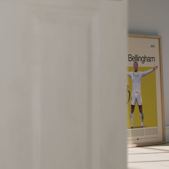 Jude Bellingham Real Madrid poster featuring the English football star with open arms in celebration. Modern sports wall art for fans and collectors, showcasing determination, strength, and passion for the game.