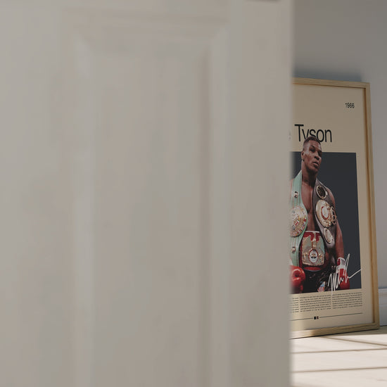 Vintage Mike Tyson poster showing the boxing legend wearing multiple championship belts. Powerful portrait of the heavyweight champion in his prime, symbolizing strength, determination, and legacy. Perfect for sports fans and collectors looking for bold, iconic wall art with a minimalist retro feel.