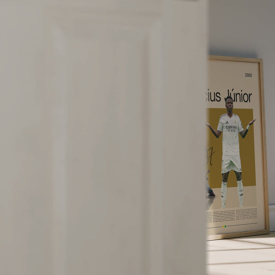 Vinícius Júnior Real Madrid football poster featuring the Brazilian superstar in a bold pose. Perfect for soccer fans, sports enthusiasts, and modern wall decor. High-quality digital artwork ideal for printing or display.