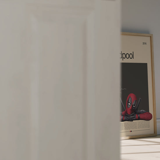 Minimalist Deadpool poster featuring the red-and-black Marvel antihero leaning on his arms with katanas behind him. Clean beige and black background design with cinematic lighting. Perfect for Marvel fans, collectors, and modern wall decor enthusiasts.